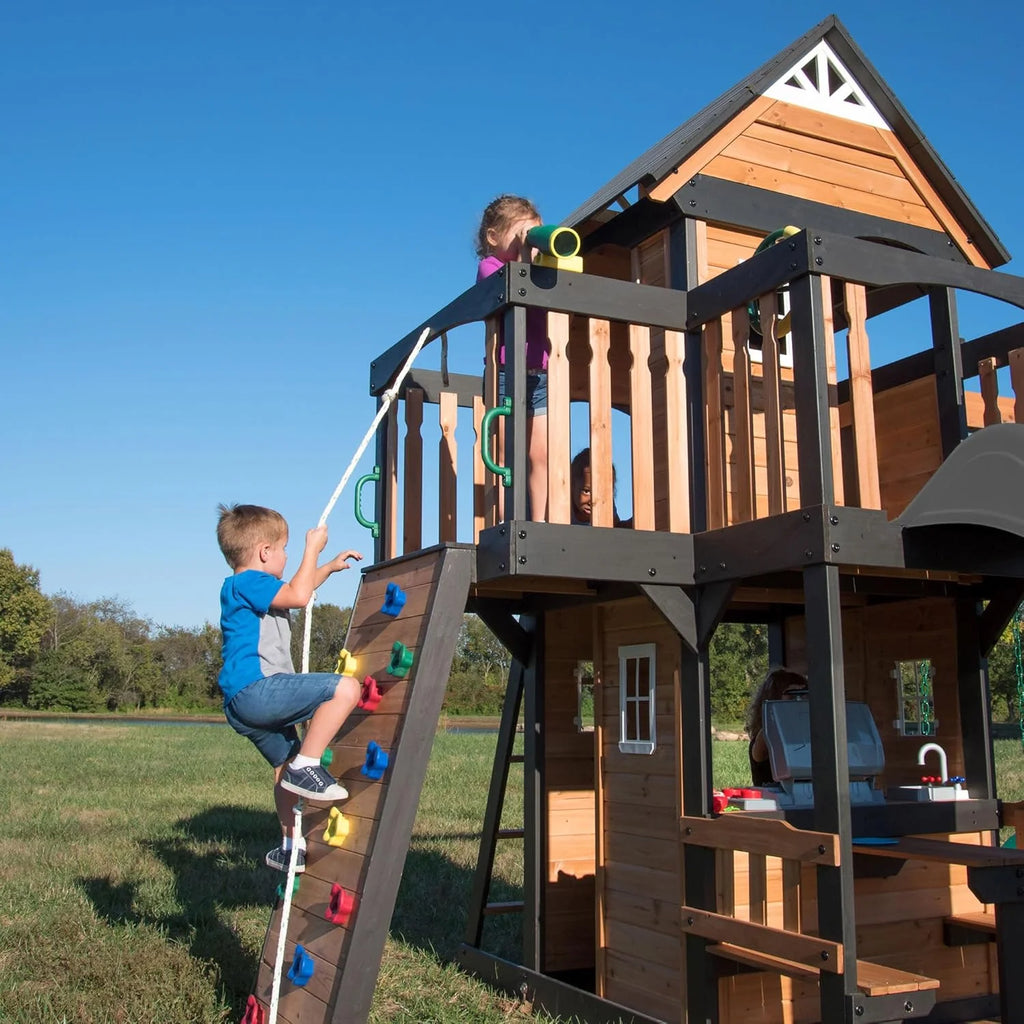 Backyard Discovery Canyon Creek Cedar Wood Swing Set with Wave Slide, Clubhouse, Play Kitchen, Picnic Area, Belt Swings, Web Swing, Rock Wall, Balconies, Playhouse, Step Ladder, Outdoor Playset